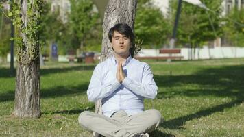 Man meditating outdoors. video