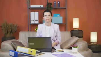Home office worker woman nervously waiting at laptop. video