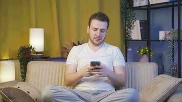 The man texting on the phone at night is unhappy and sad. video