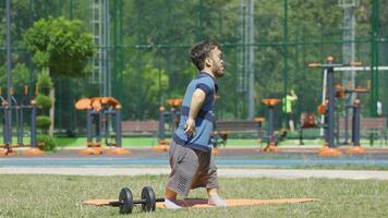 Determined and tired expression of dwarf young man ending sport. video