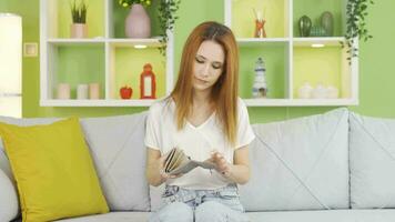 Unhappy young woman in financial crisis. video