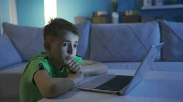 Stressed and thoughtful boy looking at computer. video