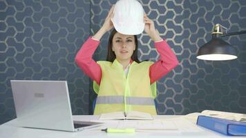 The woman engineer wearing a hard hat and smiling. video