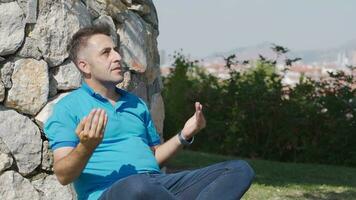 Outdoor prayer of muslim man. video