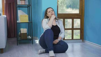 Thoughtful woman by the wall. video