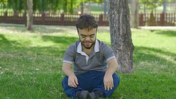 Dwarf man meditating outdoors. video