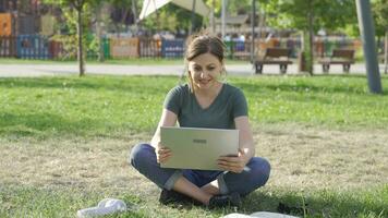 Woman making video call on laptop.