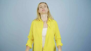 Woman calming herself by doing breathing exercises. video