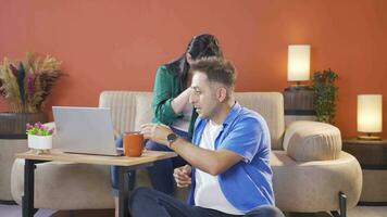 Married couple watching horror movie on laptop at home. video