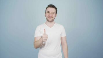 Man looking at camera making confidence sign. video