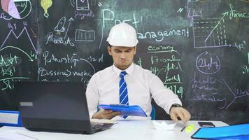 Businessman writes Port Management on the board and smiles. video