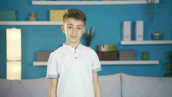 The boy nods in a positive affirmation. video