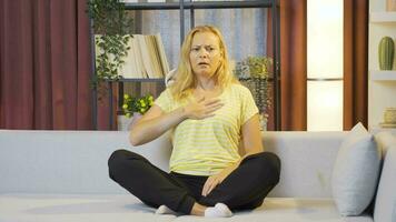 Woman with shortness of breath is breathing hard. video