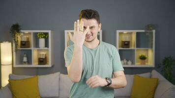 Happy and cheerful married man showing his ring to the camera. video