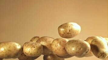Potatoes fly up and fall down. Filmed on a highspeed camera at 1000 fps. High quality FullHD footage video