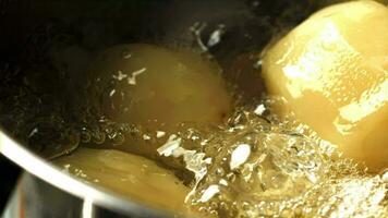 Potatoes are boiled in a saucepan. Filmed on a highspeed camera at 1000 fps. High quality FullHD footage video