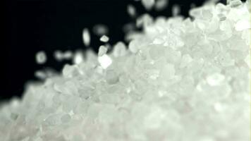 Salt crystals fall into a pile. Filmed on a highspeed camera at 1000 fps. High quality FullHD footage video