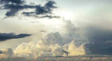 Rain clouds background with sunlight photo