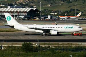 Orbest Airlines passenger plane at airport. Schedule flight travel. Aviation and aircraft. Air transport. Global international transportation. Fly and flying. photo