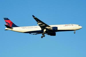 Delta Airlines passenger plane at airport. Schedule flight travel. Aviation and aircraft. Air transport. Global international transportation. Fly and flying. photo