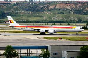 Iberia Airlines passenger plane at airport. Schedule flight travel. Aviation and aircraft. Air transport. Global international transportation. Fly and flying. photo