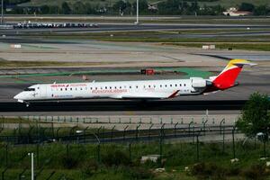 Iberia Airlines passenger plane at airport. Schedule flight travel. Aviation and aircraft. Air transport. Global international transportation. Fly and flying. photo