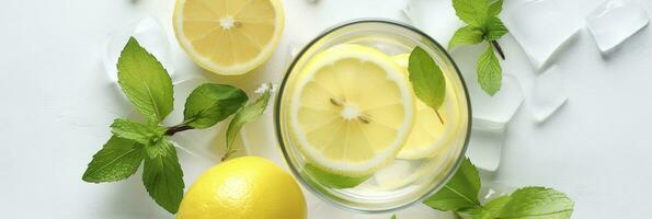 Lemonade in a glass with fresh lemons and mint. Cold summer drink with copy space. Generative AI photo