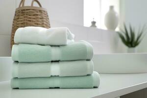 the world's softest towels against a minimalistic background. Stacked white towels sit on top of a soap dish in a bathroom. AI Generative photo