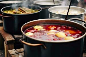 Beverages fruits and berries hot mulled wine in pots with steam in street food market. Generative AI photo