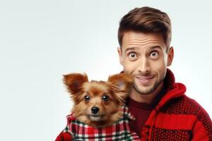 white man in warm, cozy red sweater hugging his beloved purebred pomeranian chihuahua dog. Smiles in surprise. Together with friend. Cozy and atmospheric photo. On white background AI generated photo