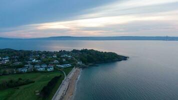 Aerial view on coast of sea at sunset in Helens Bay, Northern Ireland, UK. photo