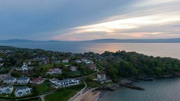 Aerial view on coast of sea at sunset in Helens Bay, Northern Ireland, UK. photo