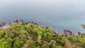 Aerial view on coast of sea at sunset in Helens Bay, Northern Ireland, UK. photo