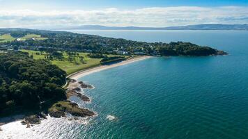 Aerial view on coast of sea at sunset in Helens Bay Northern Ireland , UK photo