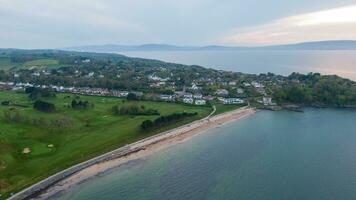 Aerial view on coast of sea at sunset in Helens Bay, Northern Ireland, UK. photo