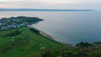 Aerial view on coast of sea at sunset in Helens Bay, Northern Ireland, UK. photo