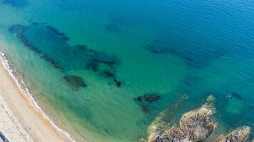 Aerial view on coast of sea at sunset in Helens Bay Northern Ireland , UK photo