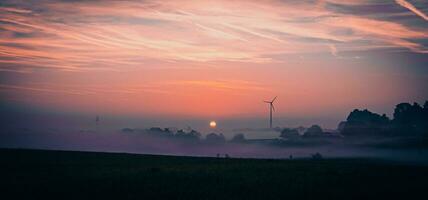 sunrise on a foggy morning photo