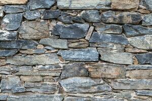 Stone wall. Outdoor background natural stone. photo