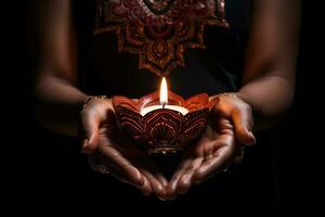 Woman hands with henna holding colorful clay diya lamps lit during diwali celebration. AI Generative photo