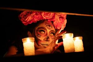 Calavera Catrina sitting on a throne. Sugar skull makeup. Dia de los muertos. Day of The Dead. Halloween. photo