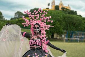 Enchanting Catrina A Dia de los Muertos Photoshoot in Cholula Cempasuchil Fields, Framed by the Iconic Cholula Church, Celebrating Beauty and Tradition photo