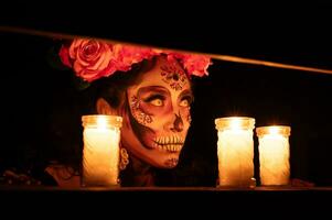 Calavera Catrina sitting on a throne. Sugar skull makeup. Dia de los muertos. Day of The Dead. Halloween. photo