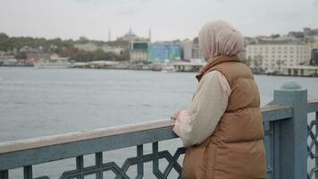 Unhappy girl standing at bench . video