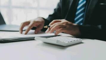 Finance Investment Ideas on Company Growth Project Success Statistics A professional investor working on starting a project for a strategic plan with a document, a laptop, on an office table. video