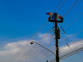 The kite caught in an electric pole photo