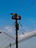 The kite caught in an electric pole photo