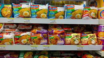 Yogyakarta, Indonesia - May 17, 2023, Various choice of instant noodles display on shelf store photo
