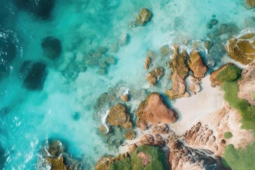 a beach with rocks and water photo