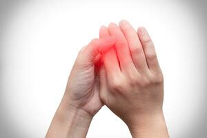 Woman hands holding isolated on white background with red spot on finger pain. Healthcare problem. Pain and infection. photo